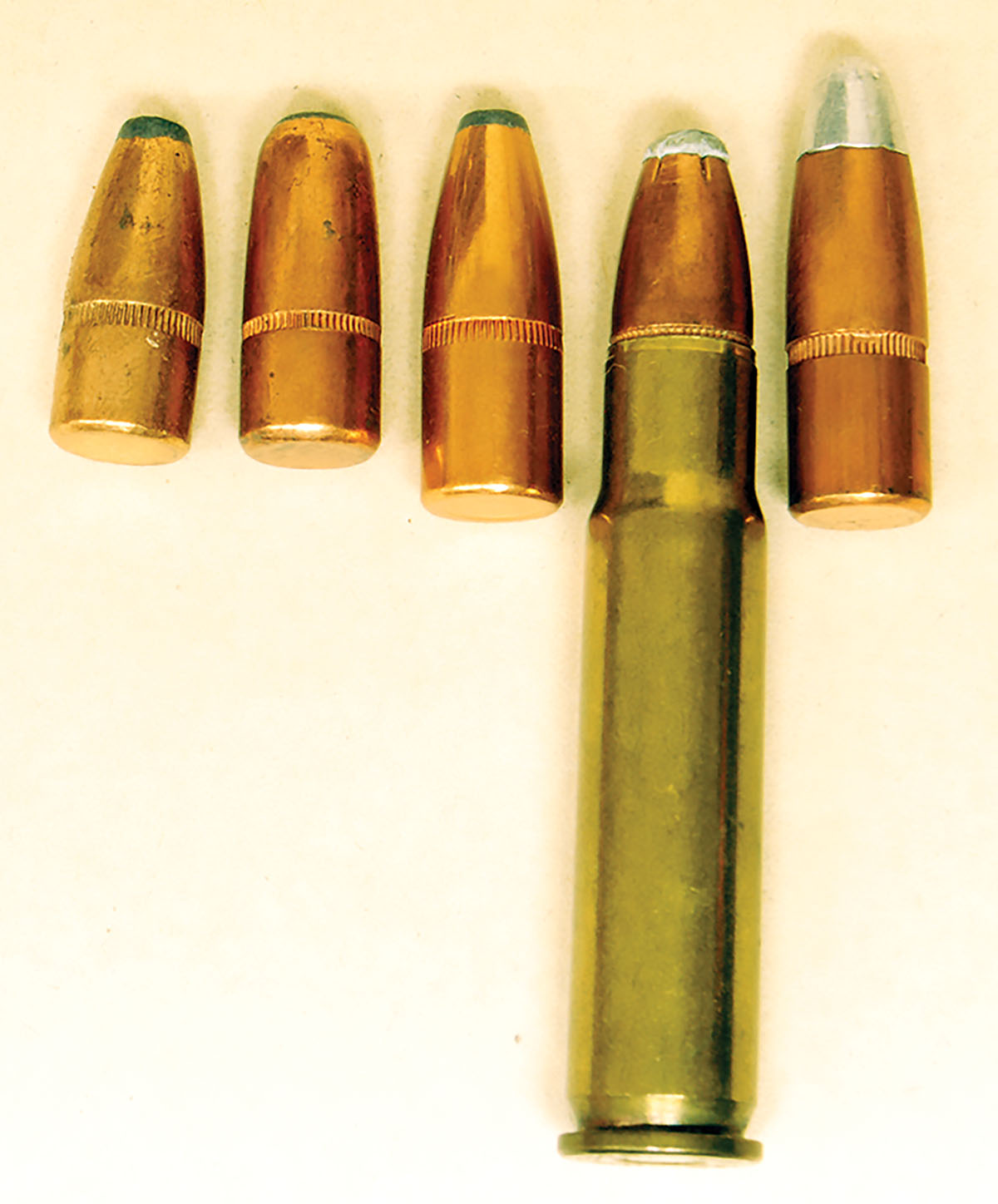 The seating depth of the 356 Winchester is determined by the location of the cannelure and the length of the Model 94 action. The  180-, 200- and 220-grain bullets to the left of the cartridge will work while the 250-grain bullet on the right will not.